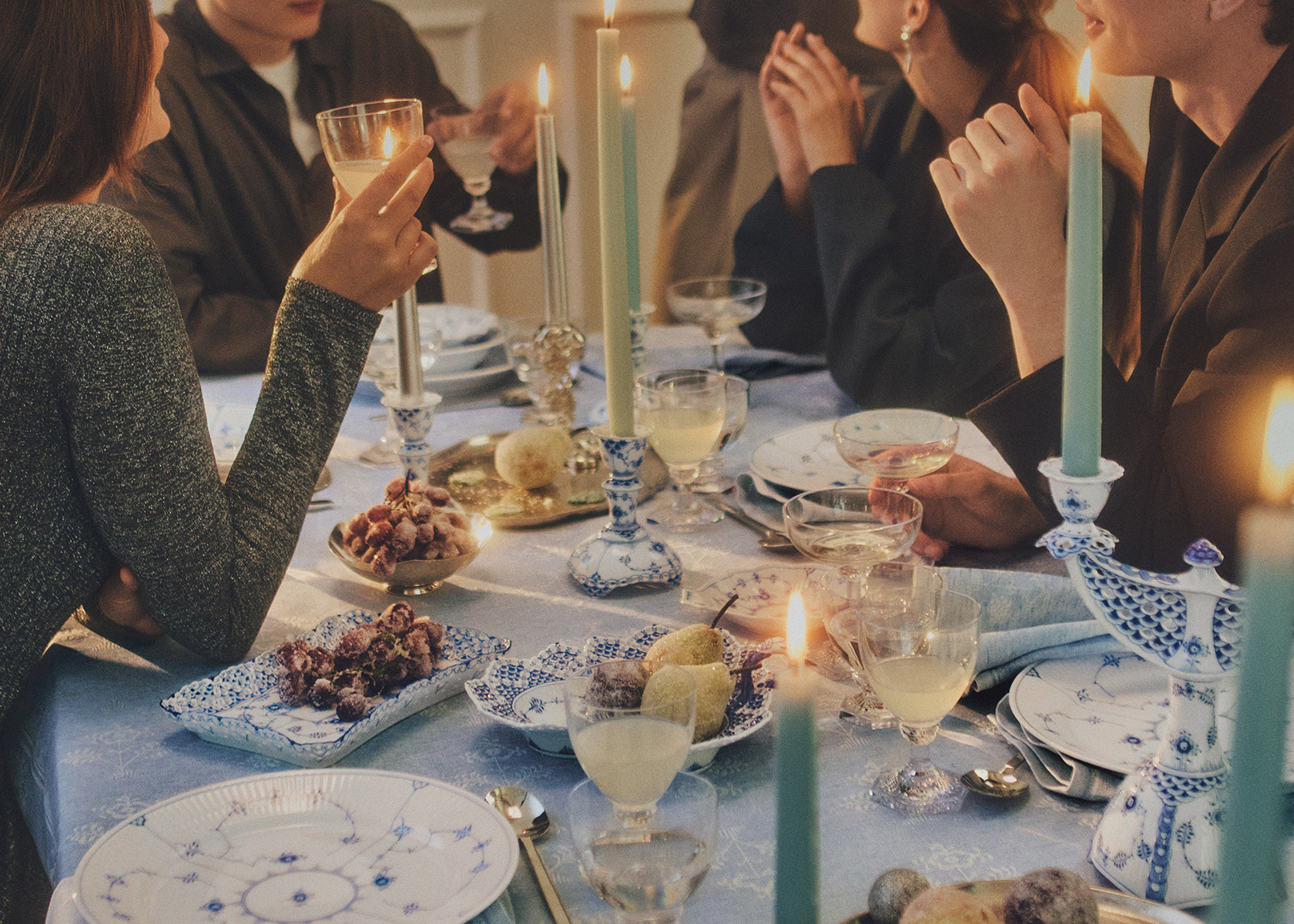 A christmas gathering with friends and a beautiful set table with all Royal Copenhagen